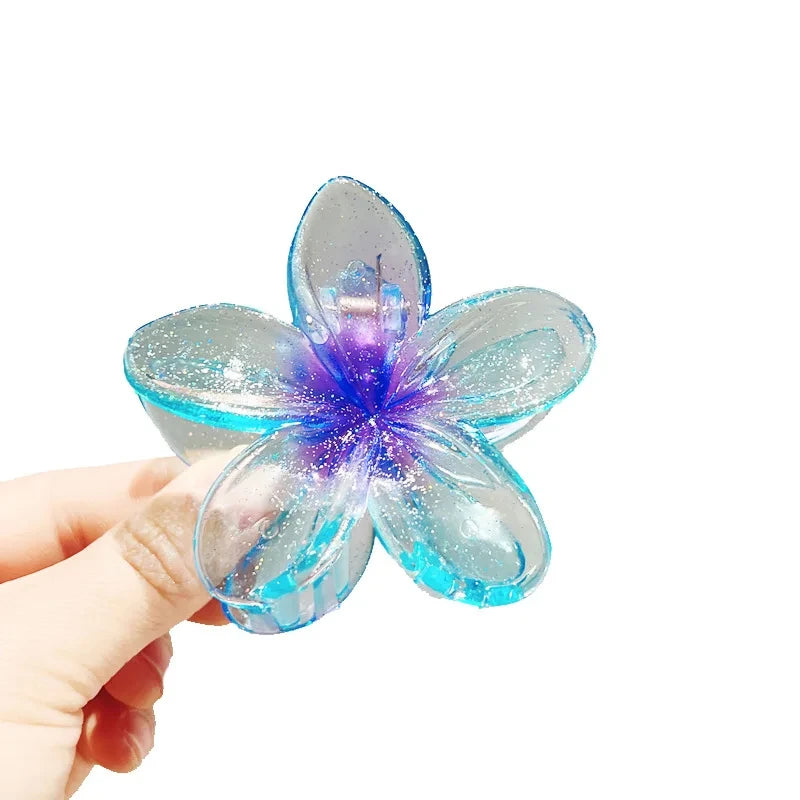 Glitzernde Haarkralle mit Blumenmotiv