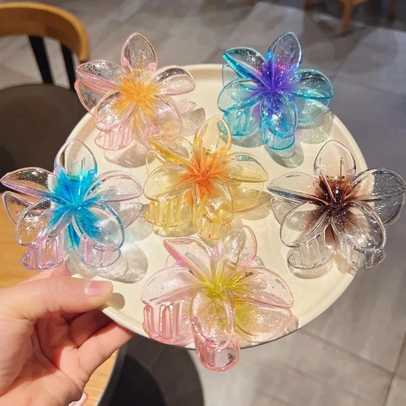 Glitzernde Haarkralle mit Blumenmotiv