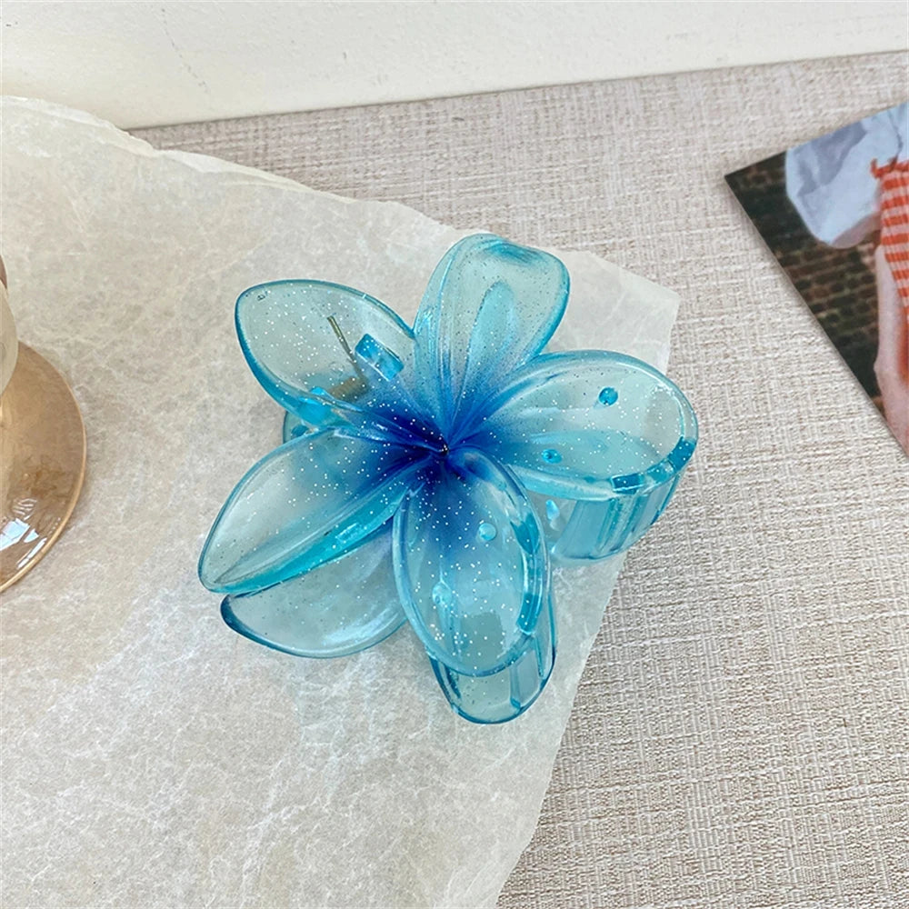 Glitzernde Haarkralle mit Blumenmotiv