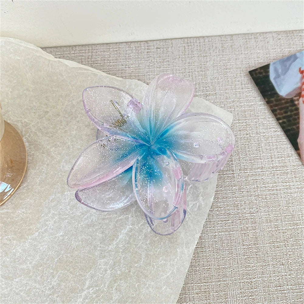 Glitzernde Haarkralle mit Blumenmotiv