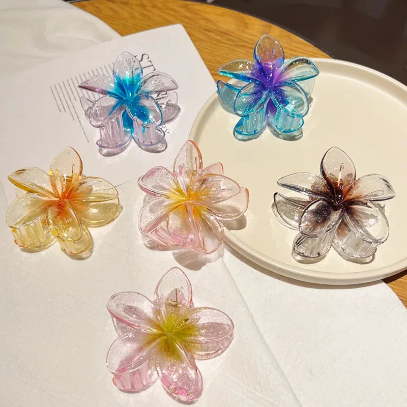 Glitzernde Haarkralle mit Blumenmotiv
