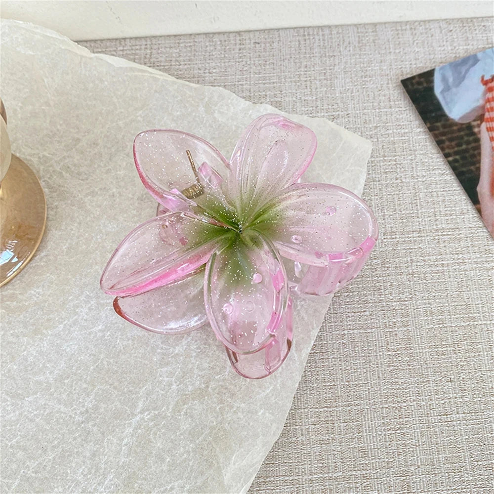 Glitzernde Haarkralle mit Blumenmotiv