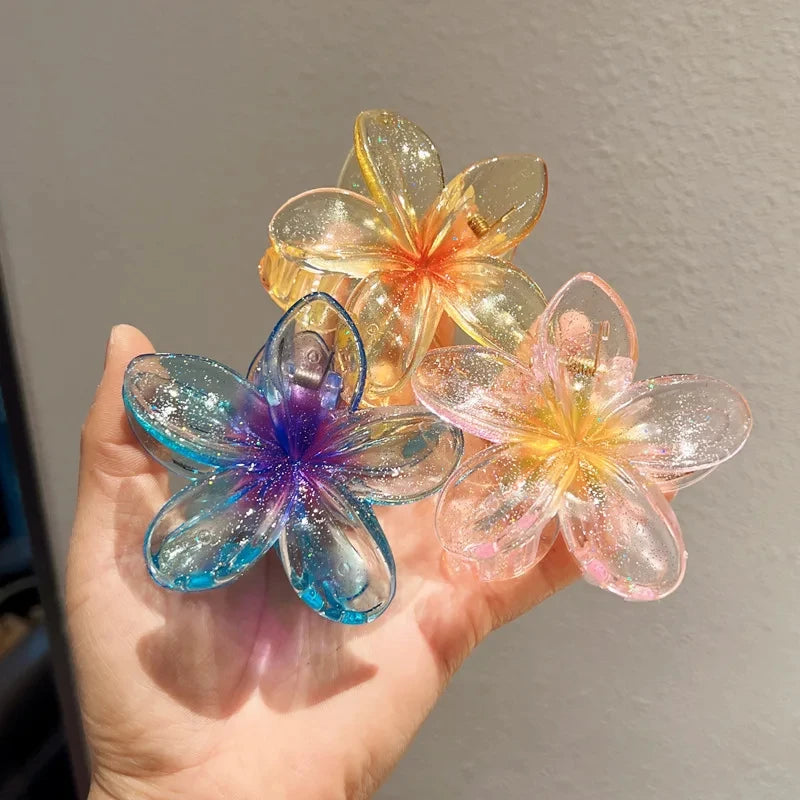Glitzernde Haarkralle mit Blumenmotiv